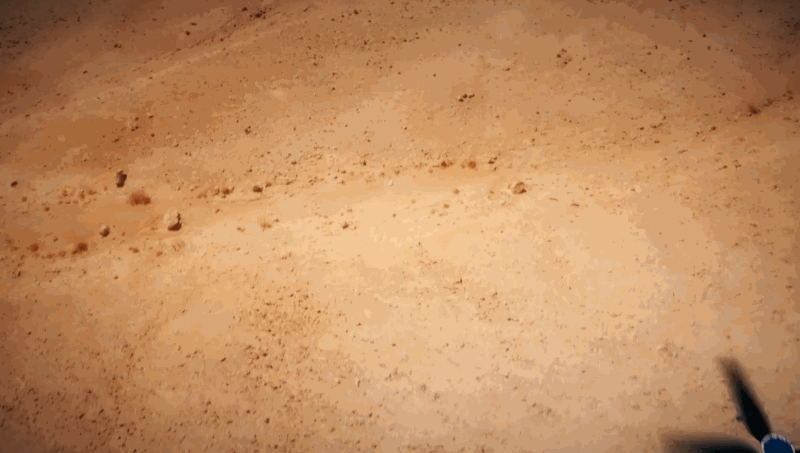 Animated image showing the Ingenuity Mars helicopter taking off and flying on Mars.