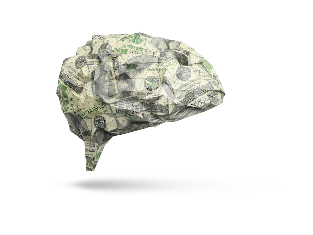 abstract human brain made out of dollar bills isolated on white background